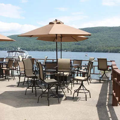 Lakeside patio with tables and umbrellas