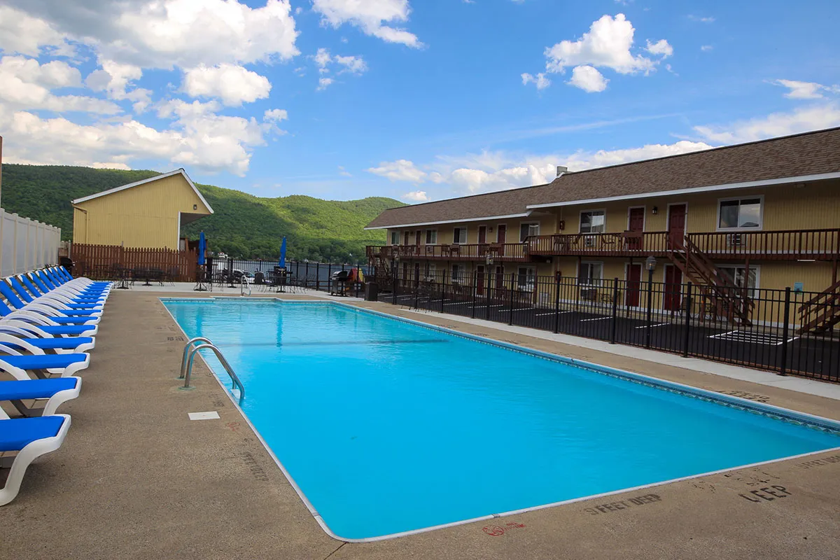 In-ground pool along the motels rooms